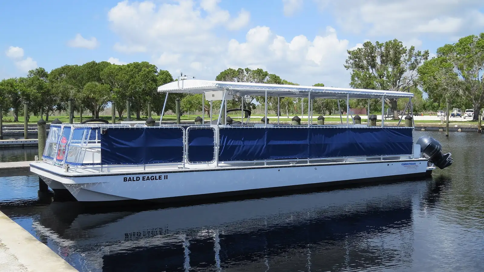 Everglades tour pontoon boat docked in Florida